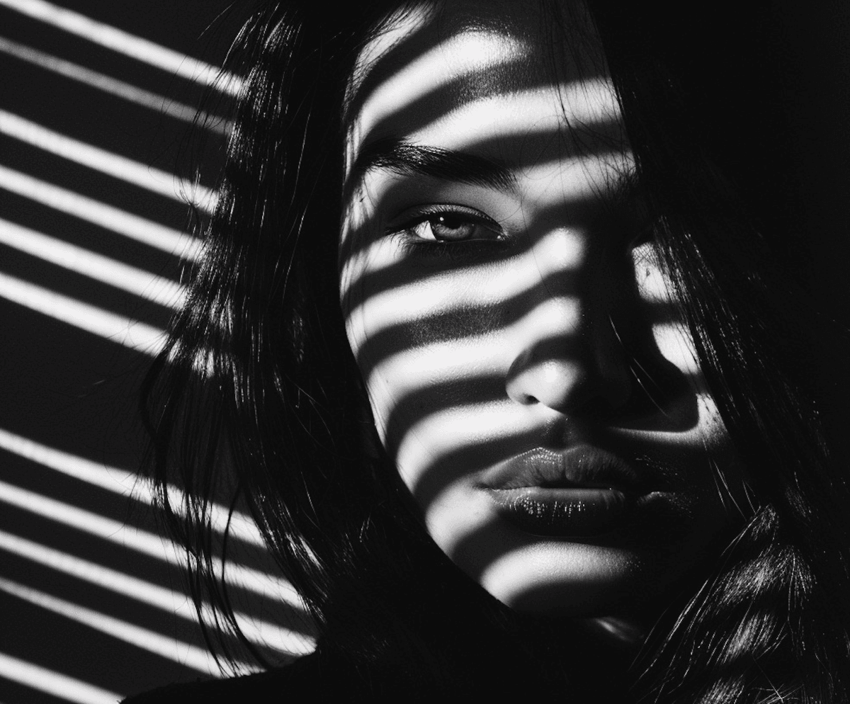 Black and white portrait with bold horizontal stripe pattern