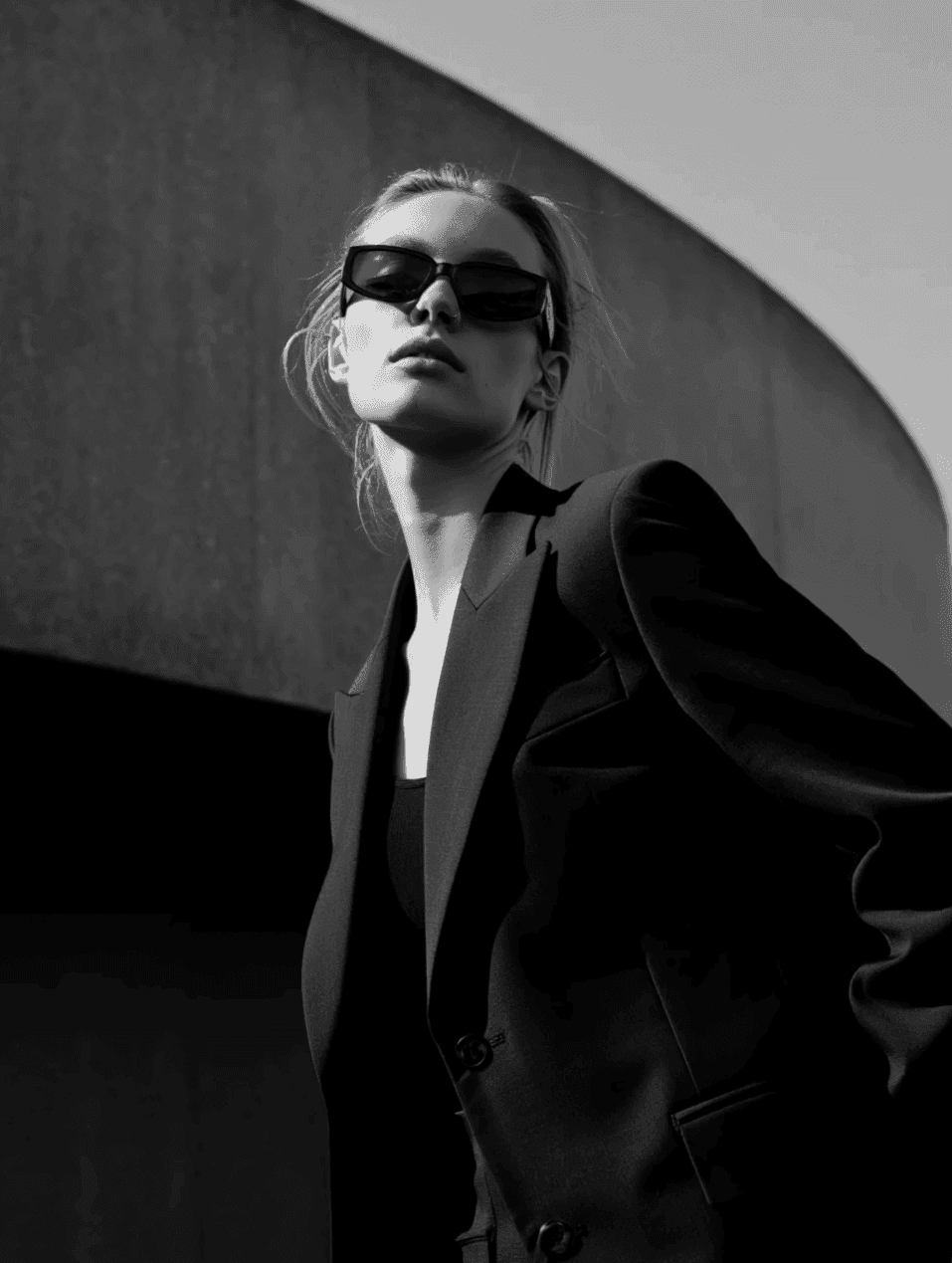 Black and white close-up portrait with dramatic shadow