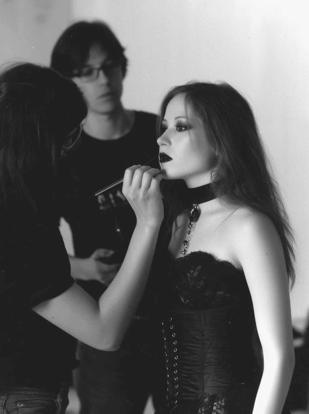 Two women in an editorial scene with dramatic lighting